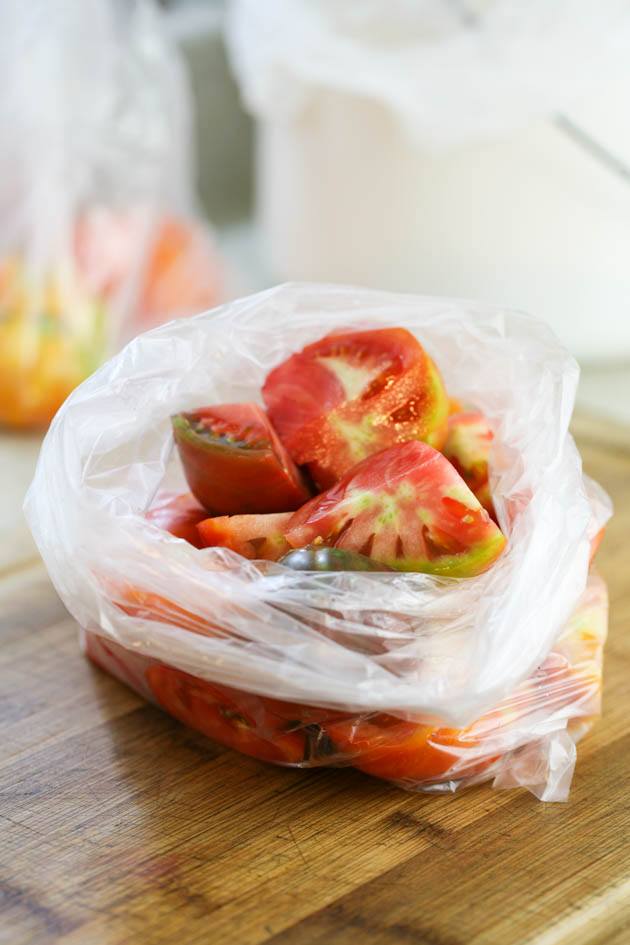 Cut tomatoes in a bag ready for freezing.