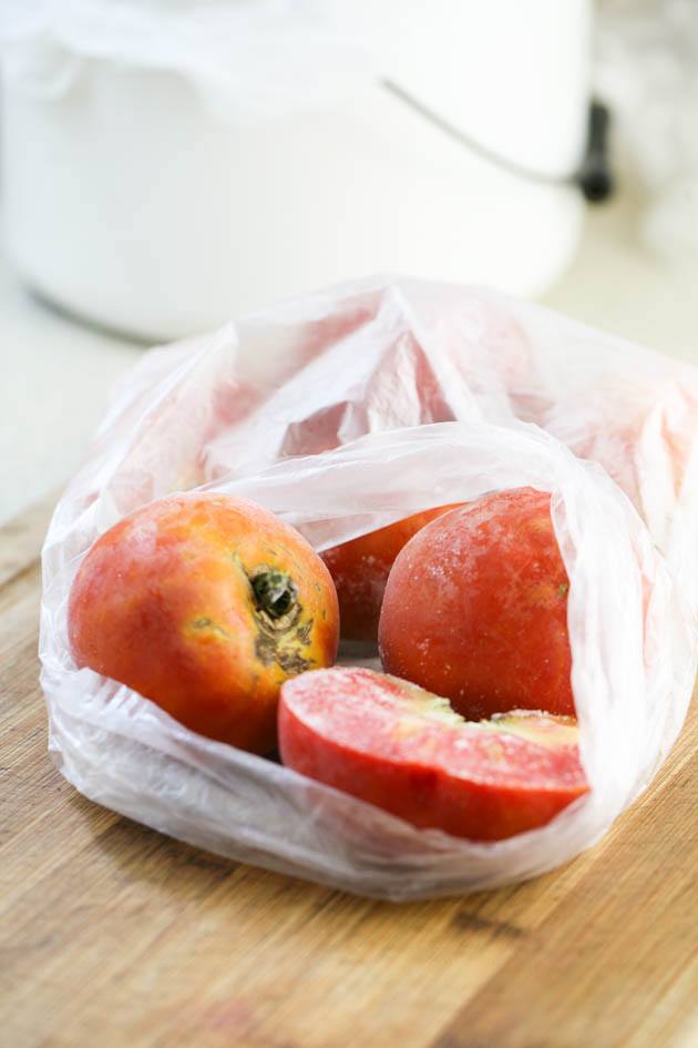 Frozen tomatoes in a bag.