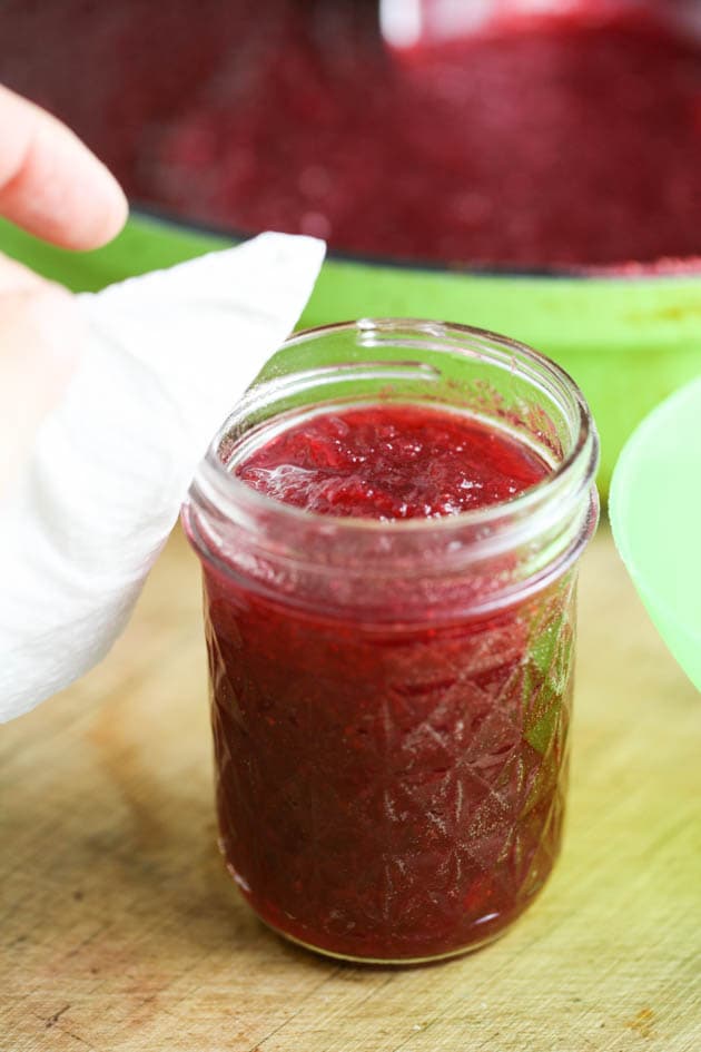 Cleaning the rim of the jar. 