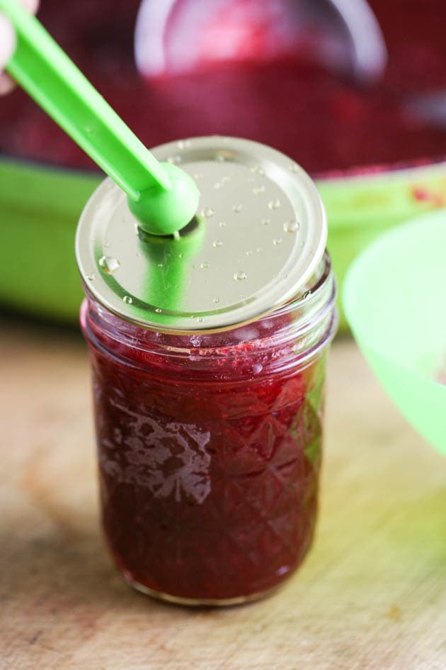 Covering the jar with the lid.