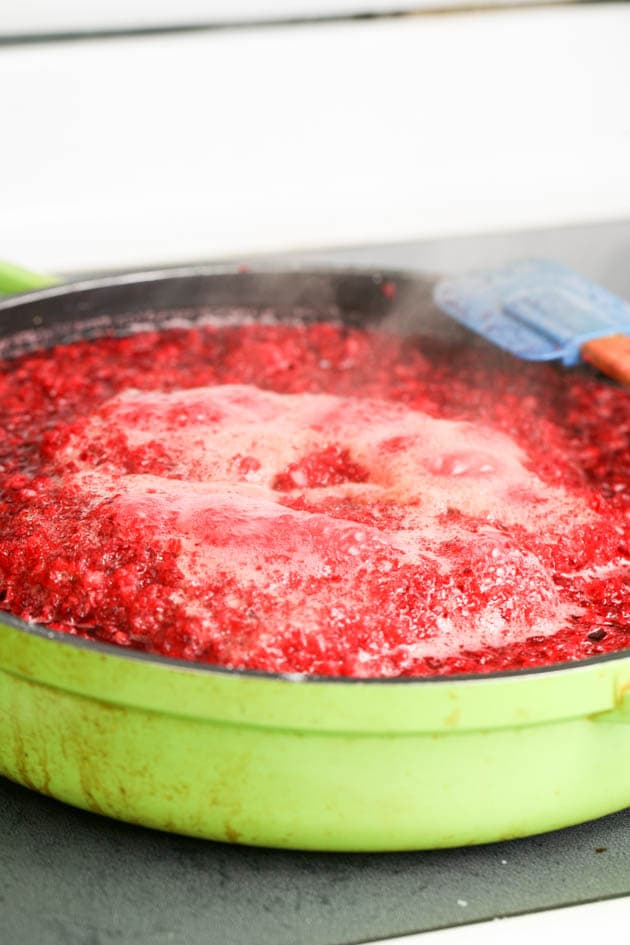 Bringing the jam mixture to a boil.