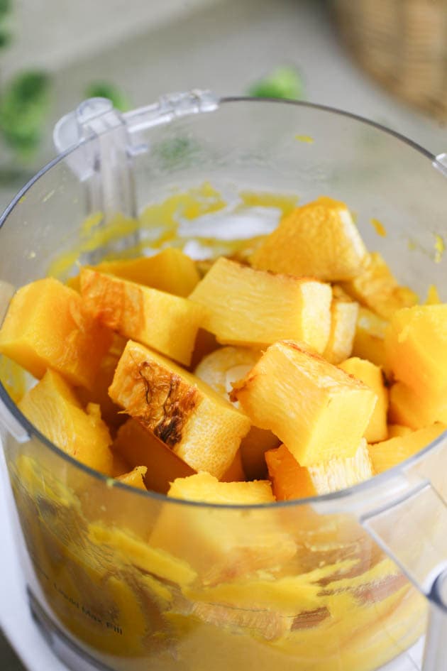 Processing the soft pumpkin flesh into a puree in the food processor.