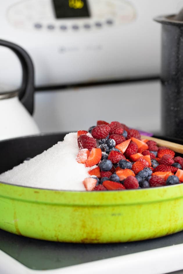 Berries and sugar in a pot ready for cooking