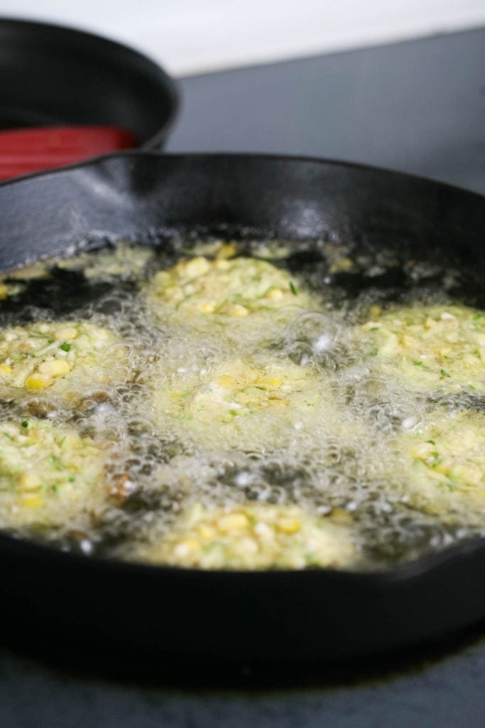 Fritters frying in the pan. 