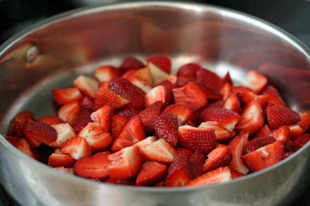 Diced strawberries in a pan ready for jam making