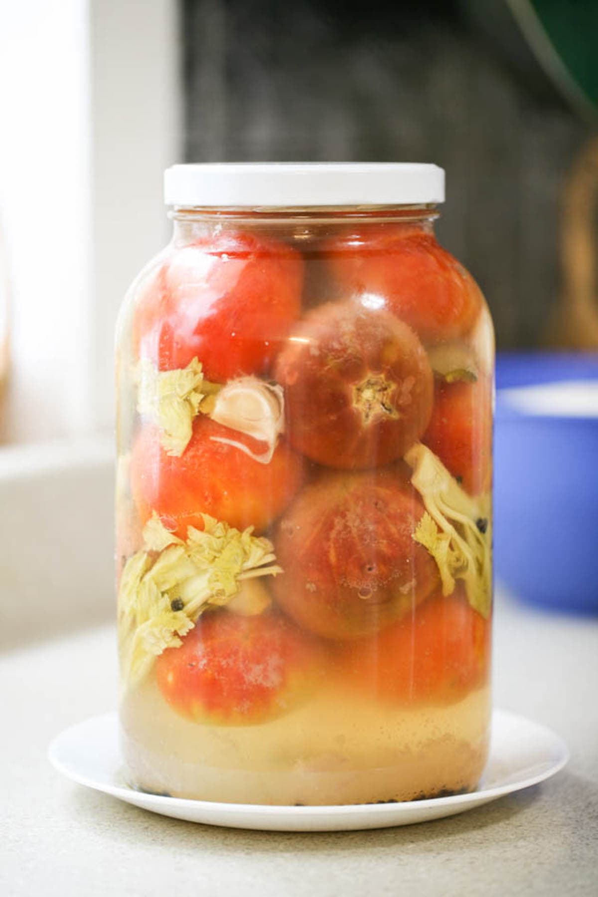 Foggy brine in the fermented tomato jar. 