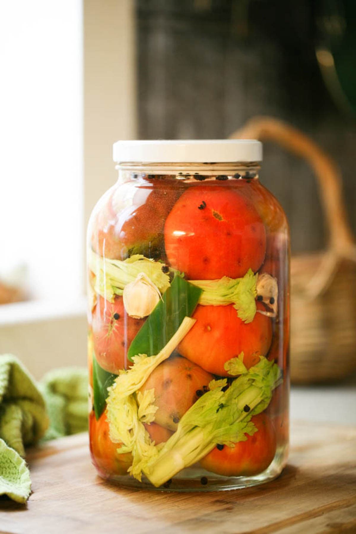 Fermenting tomatoes is a great way to preserve tomatoes without cooking them and it takes minutes to prepare a huge jar. Learn how to ferment tomatoes and use your fermented tomatoes as a side dish, in salads, or add them to sandwiches. 