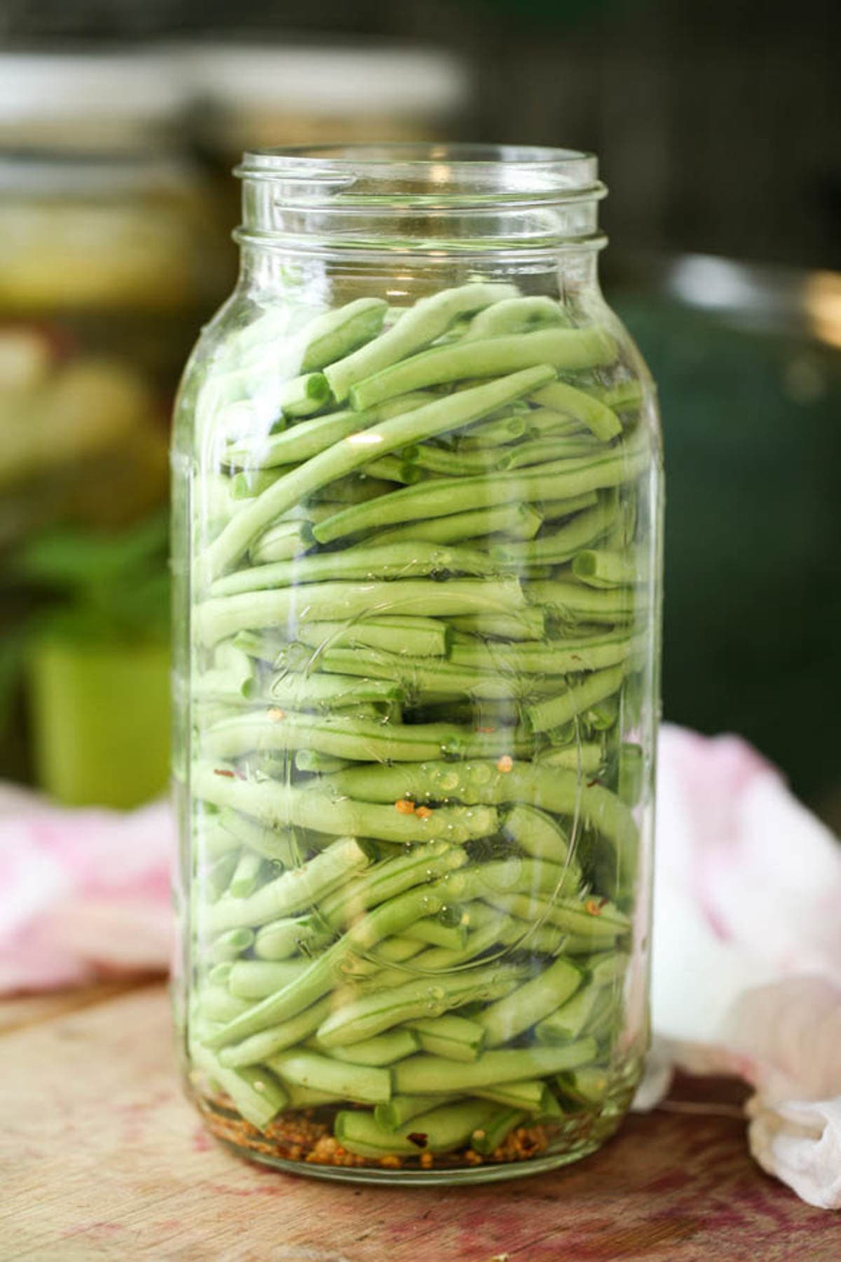 Packing the jar with green beans.