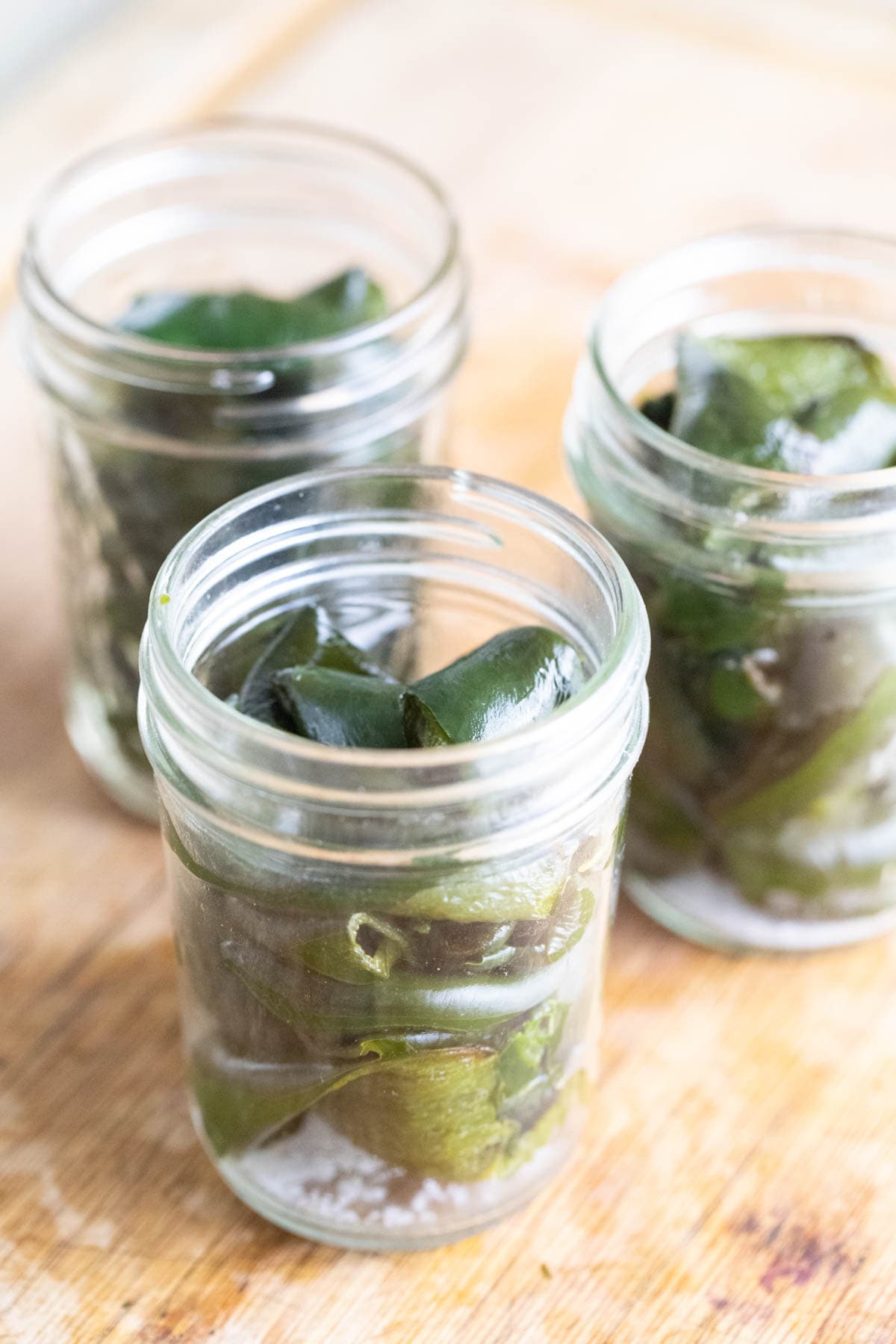 Packing the jars with roasted poblano peppers. 