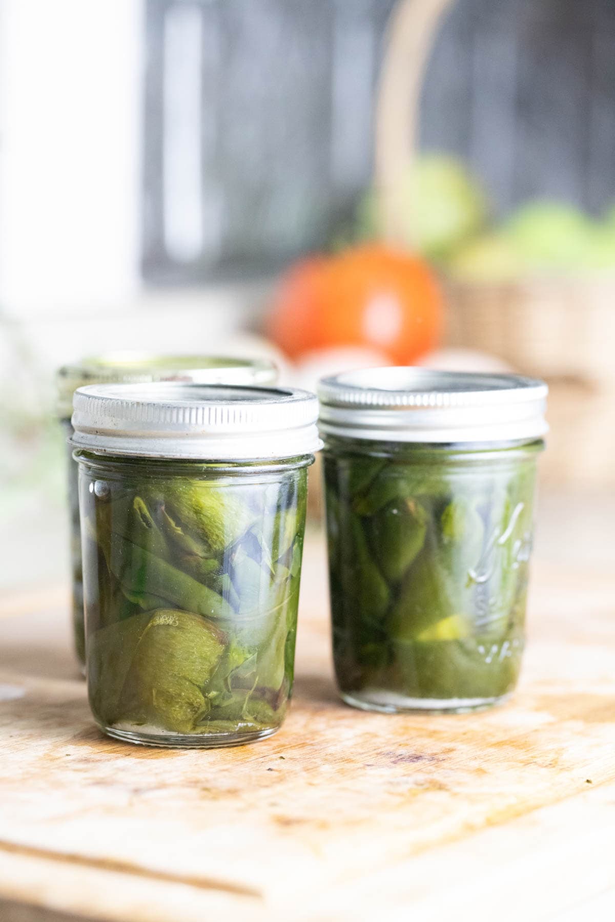 Jars of roasted poblano peppers are ready for processing. 