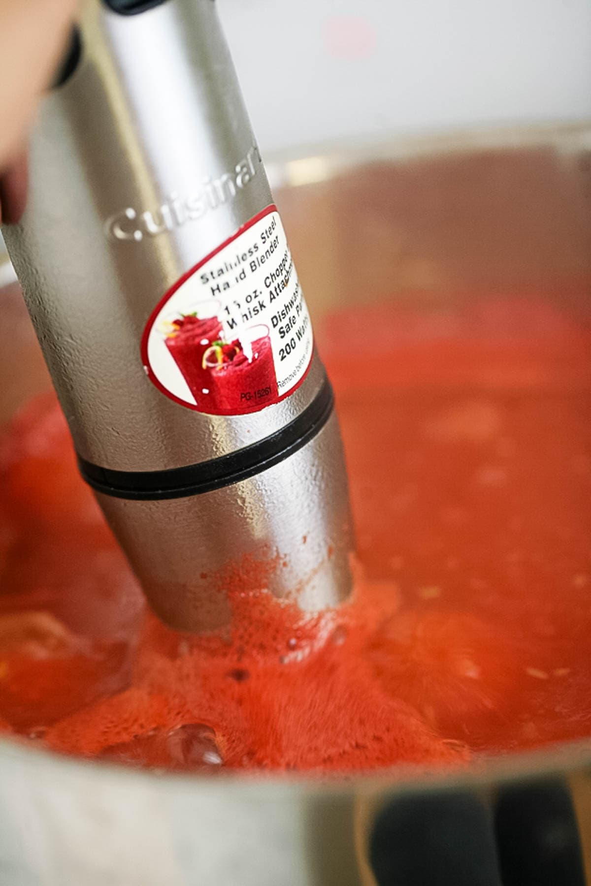 Blending the tomatoes into sauce.