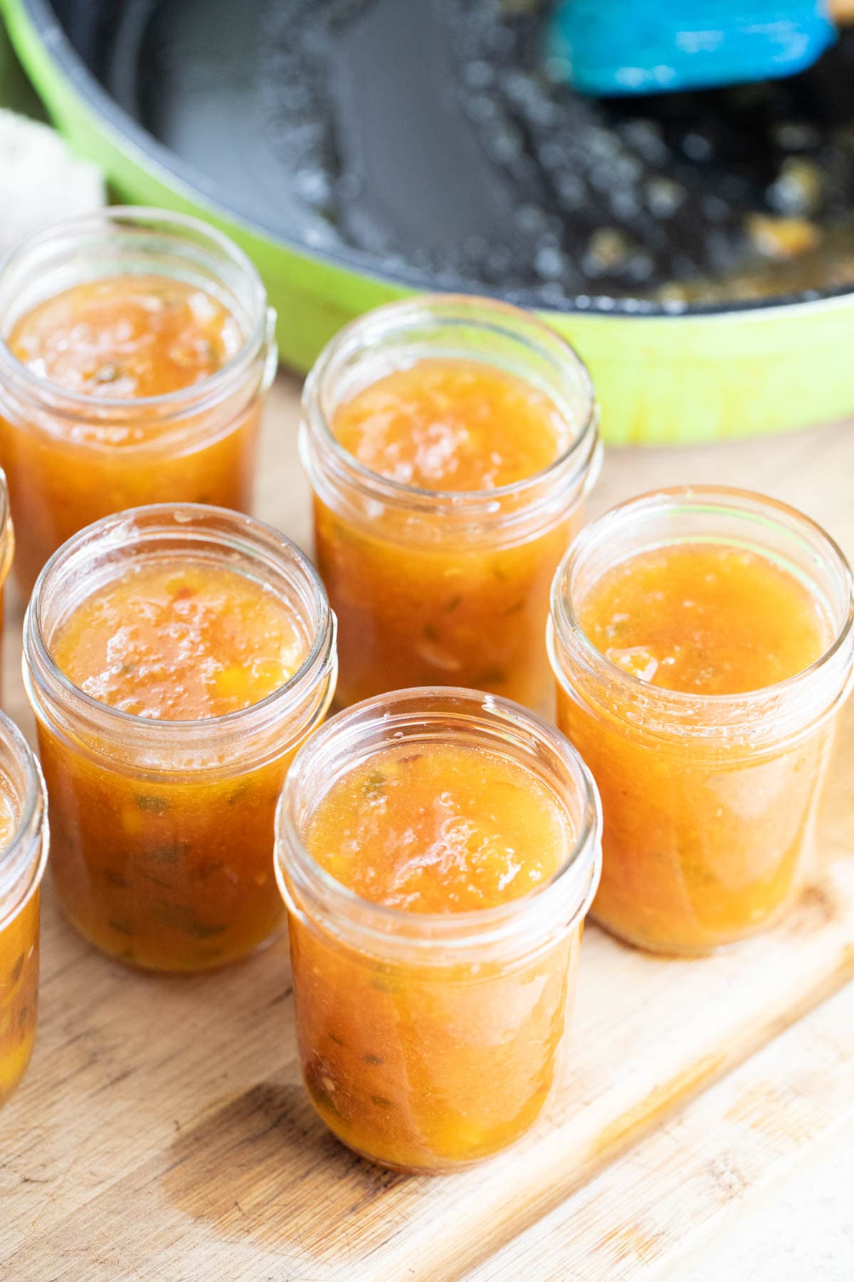 Filling the jars with peach jalapeno jam. 