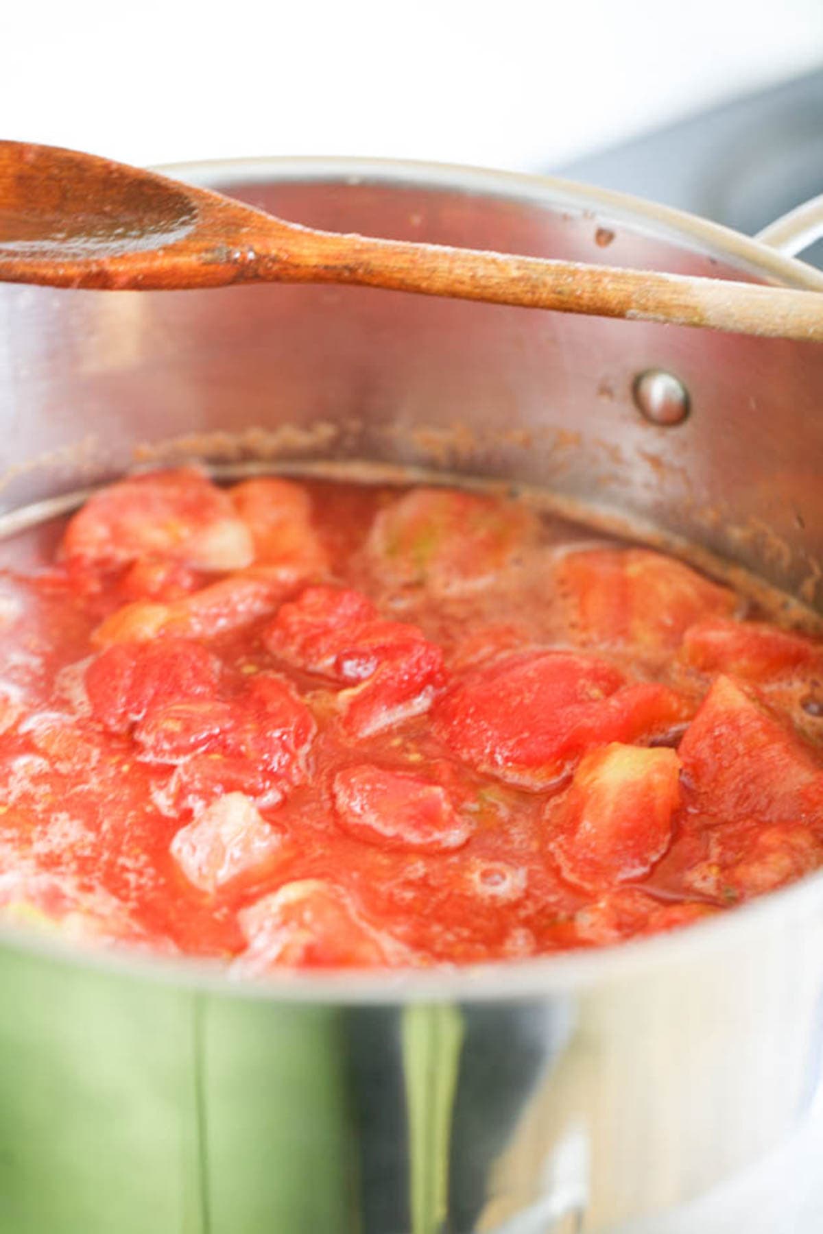 bringing tomatoes to a boil