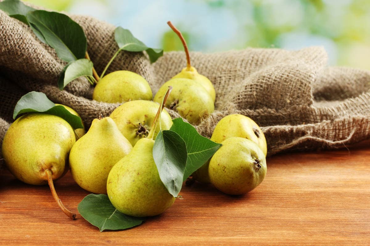 fresh pears on a wooden board