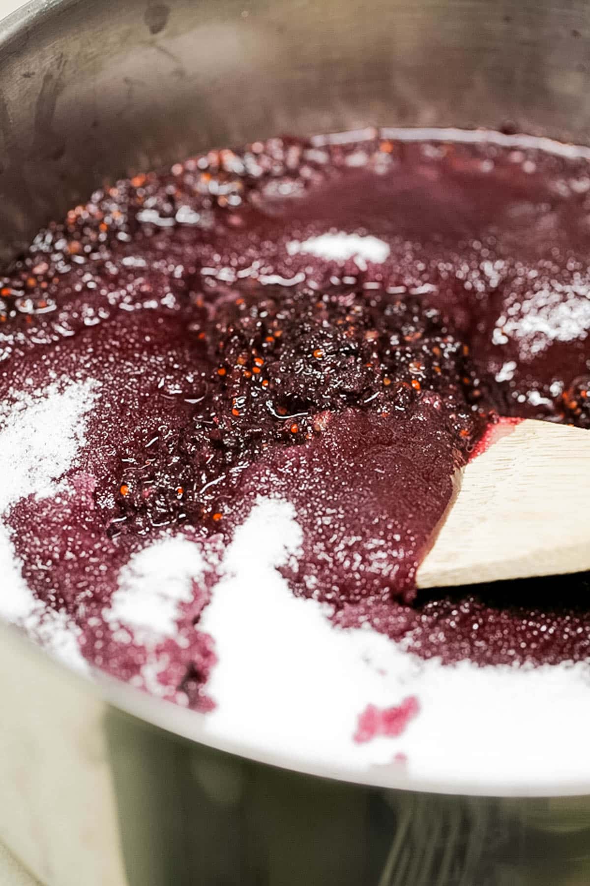 mulberries and sugar in a pan