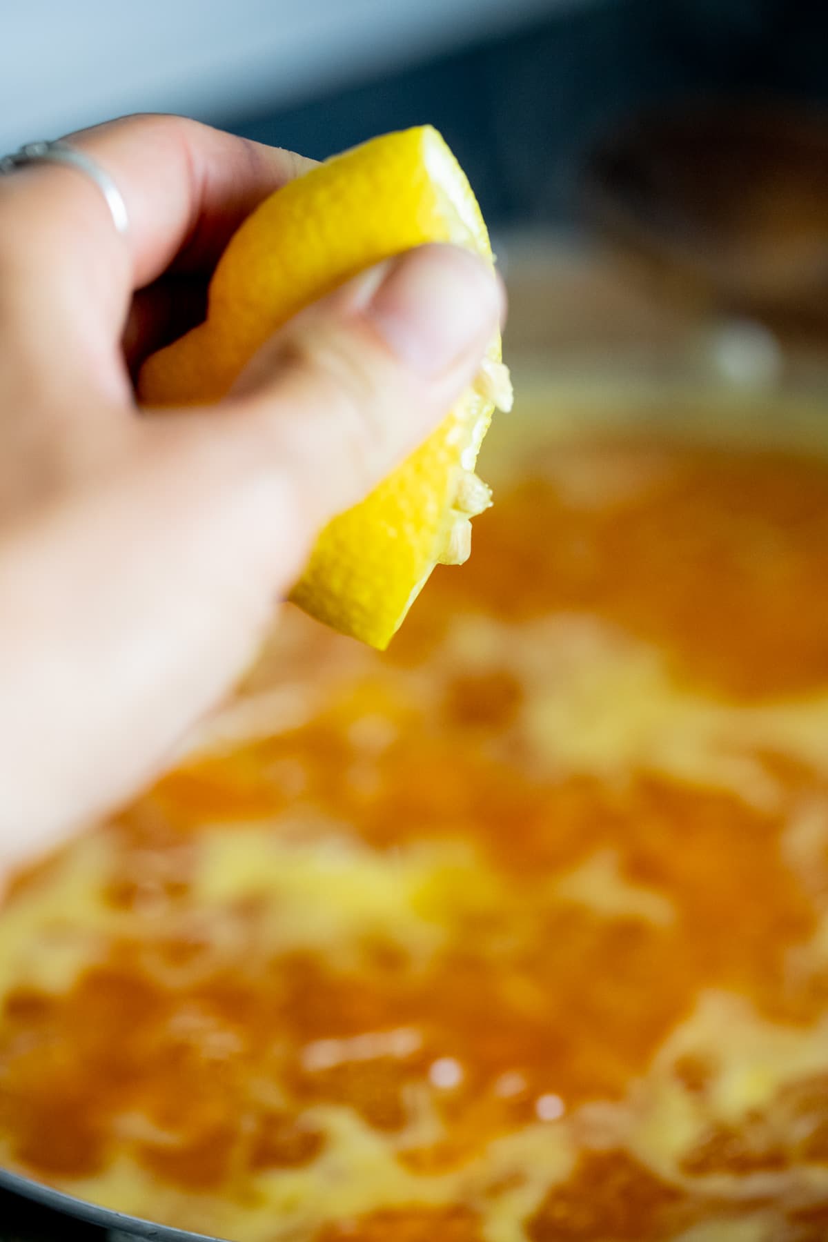 adding lemon juice to the apricot jam