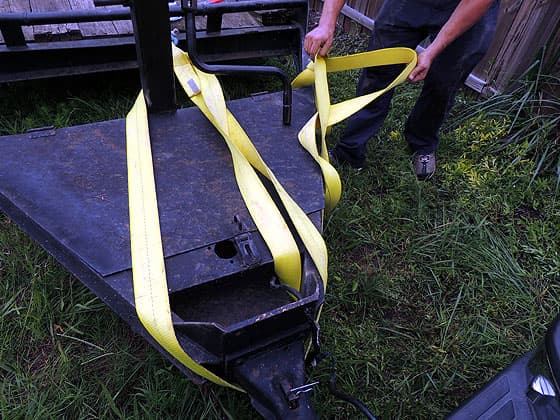connecting the strap to the trailer's neck
