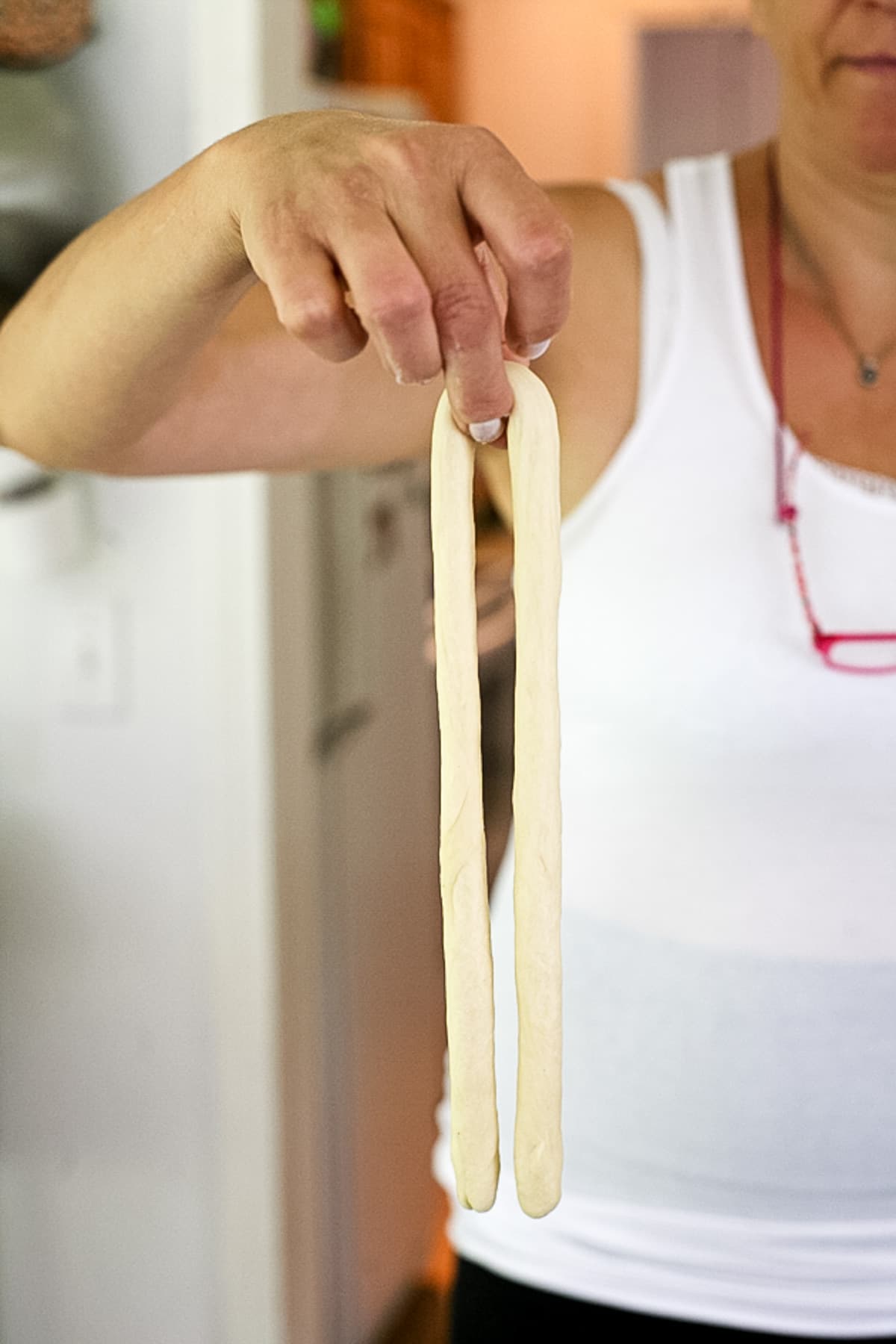 lift the strand of dough from it's middle