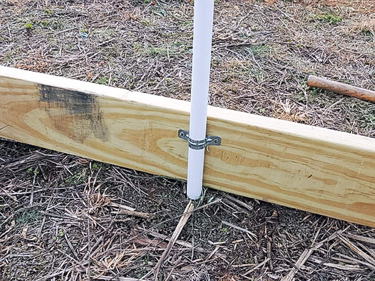 using a rigid strap to connect the pvc to the frame 