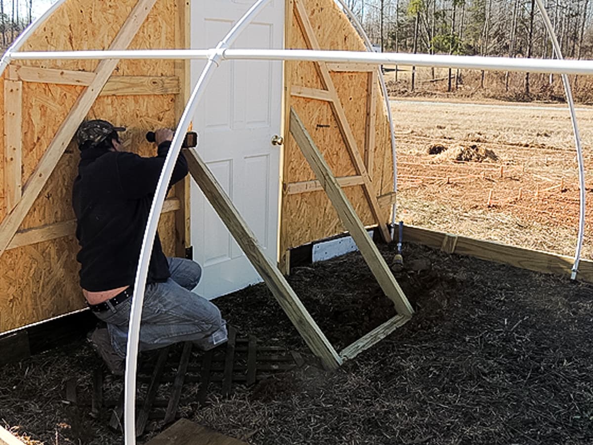 installing support for the doors of the greenhouse