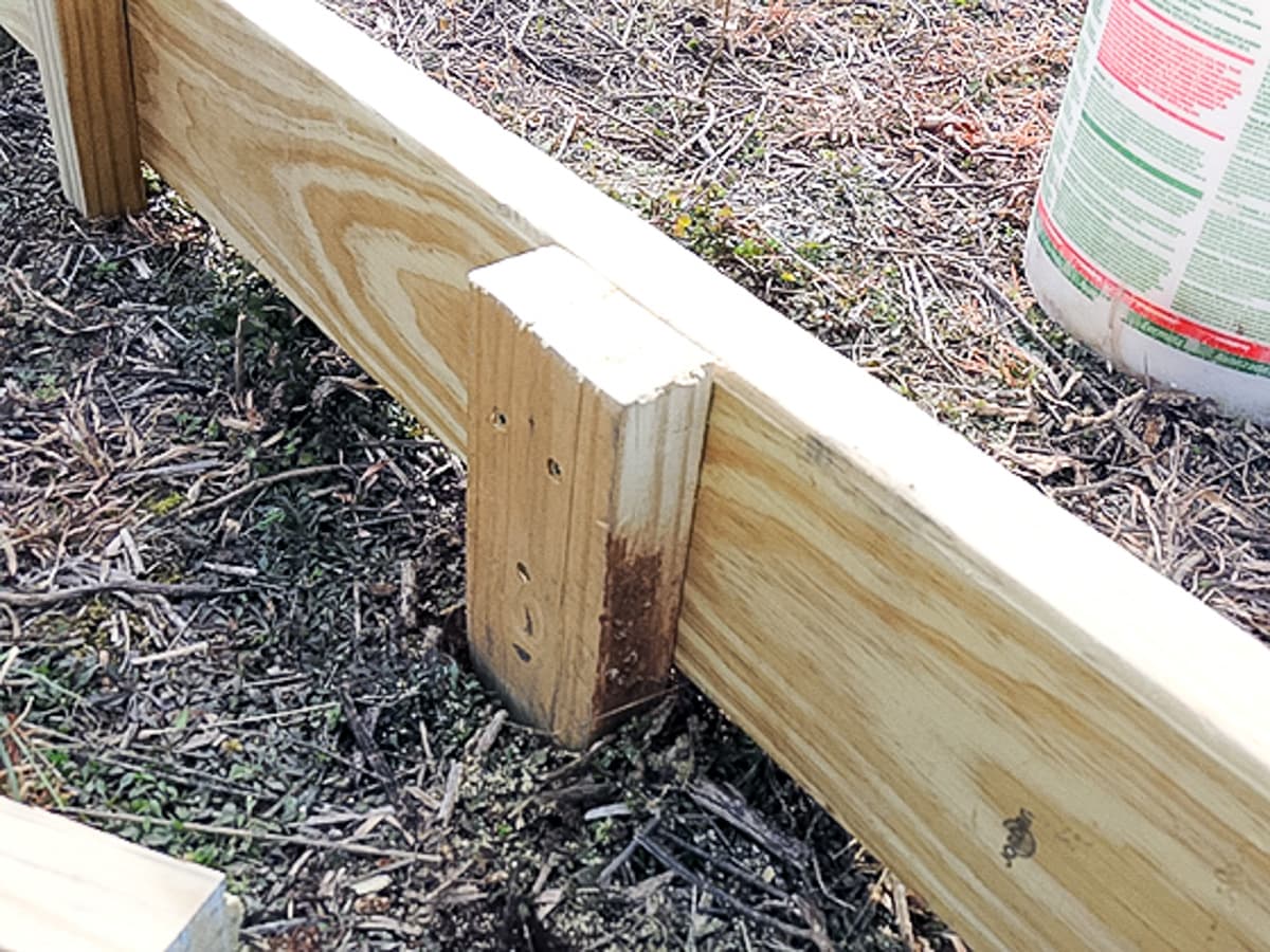 using 2x4 to hold the frame to the ground