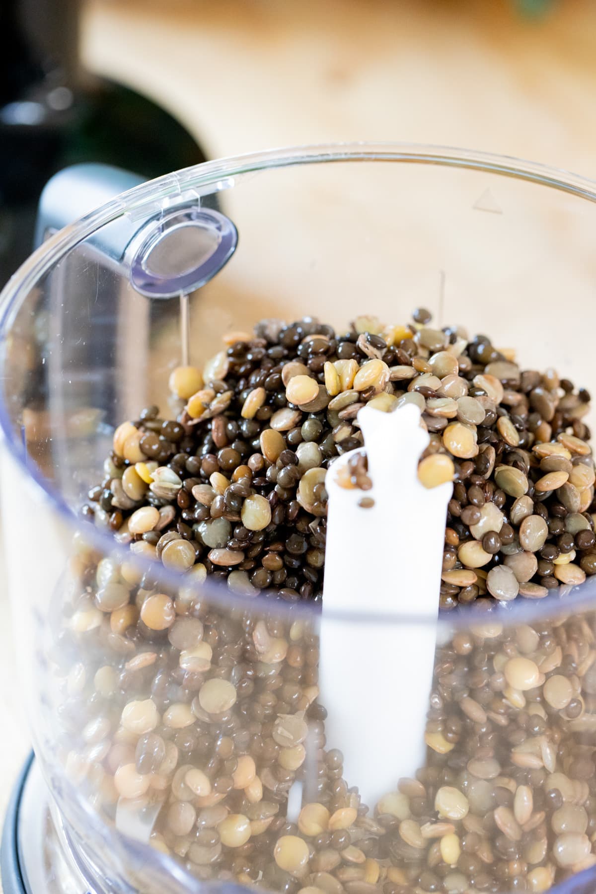 add lentils to the bowl of the food processor
