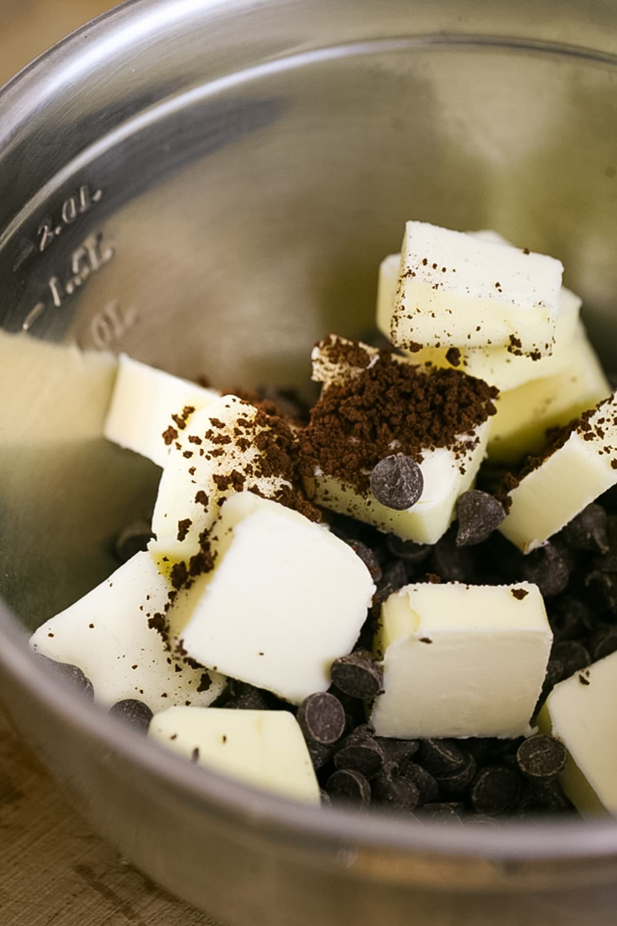 add chocolate, butter, and instant coffee to the bowl of a double boiler