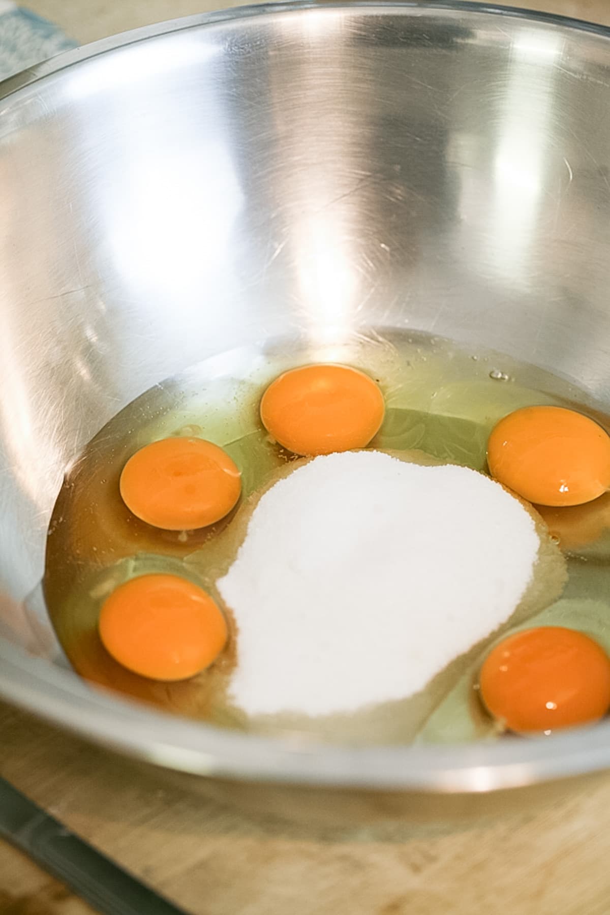 add eggs and sugar to the bowl of the mixer