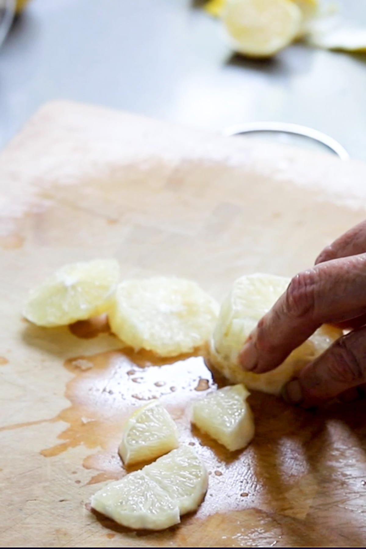 peeling and slicing the lemon