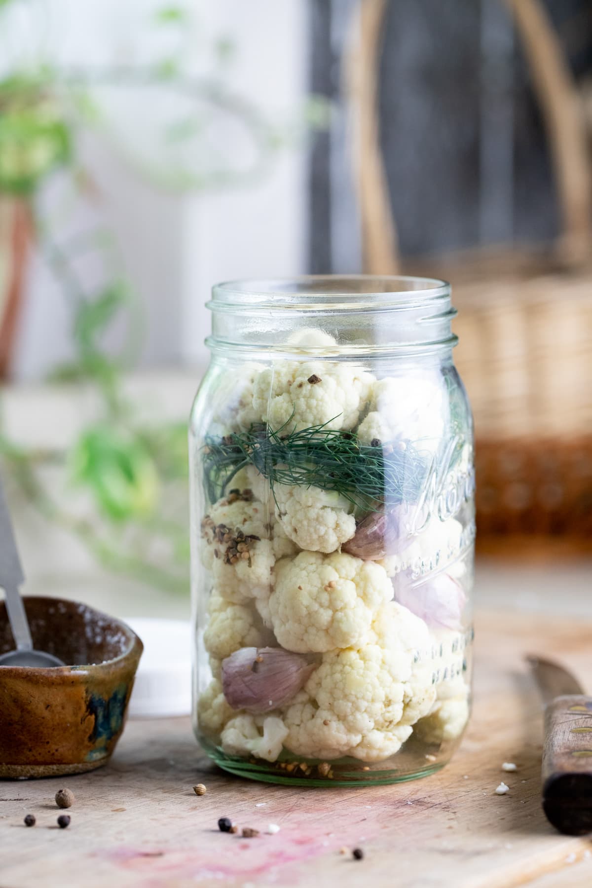 packing the jar with cauliflower and spices