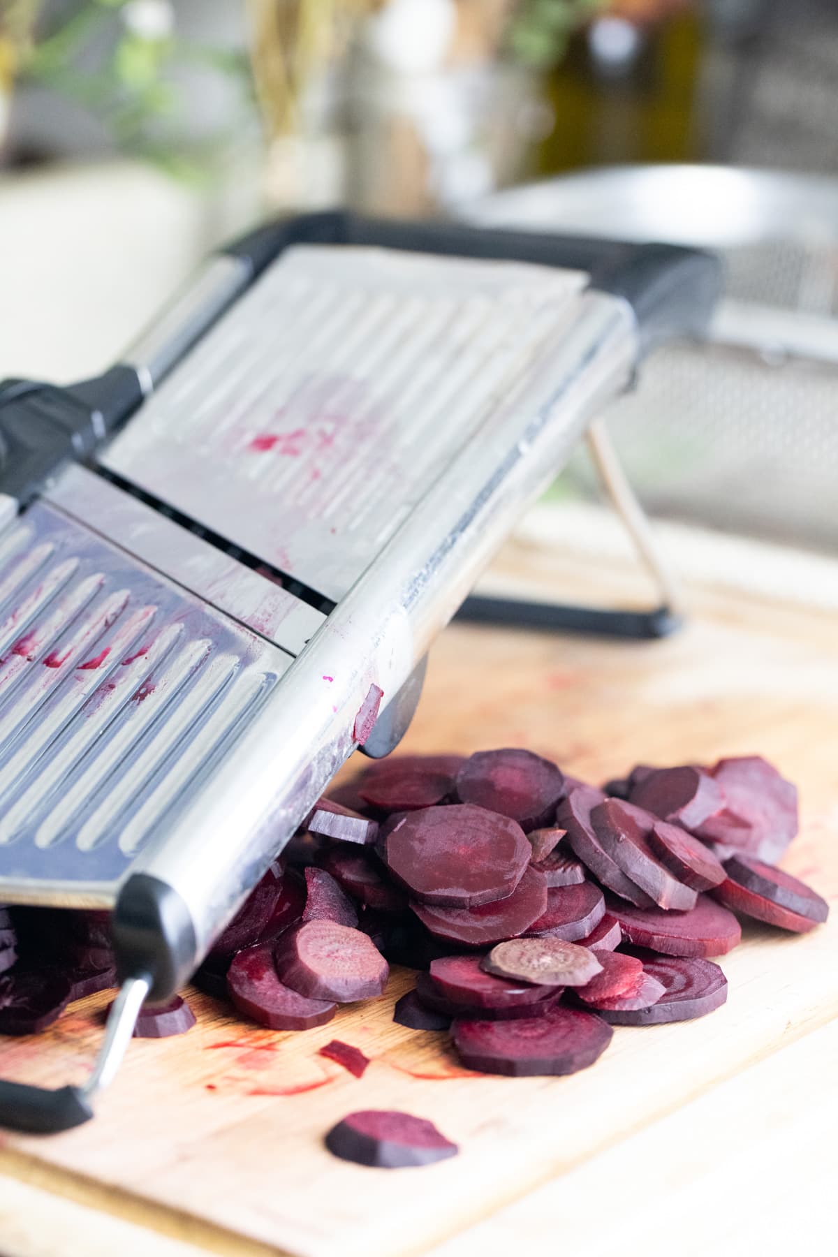 slicing beets with a kitchen mandoline