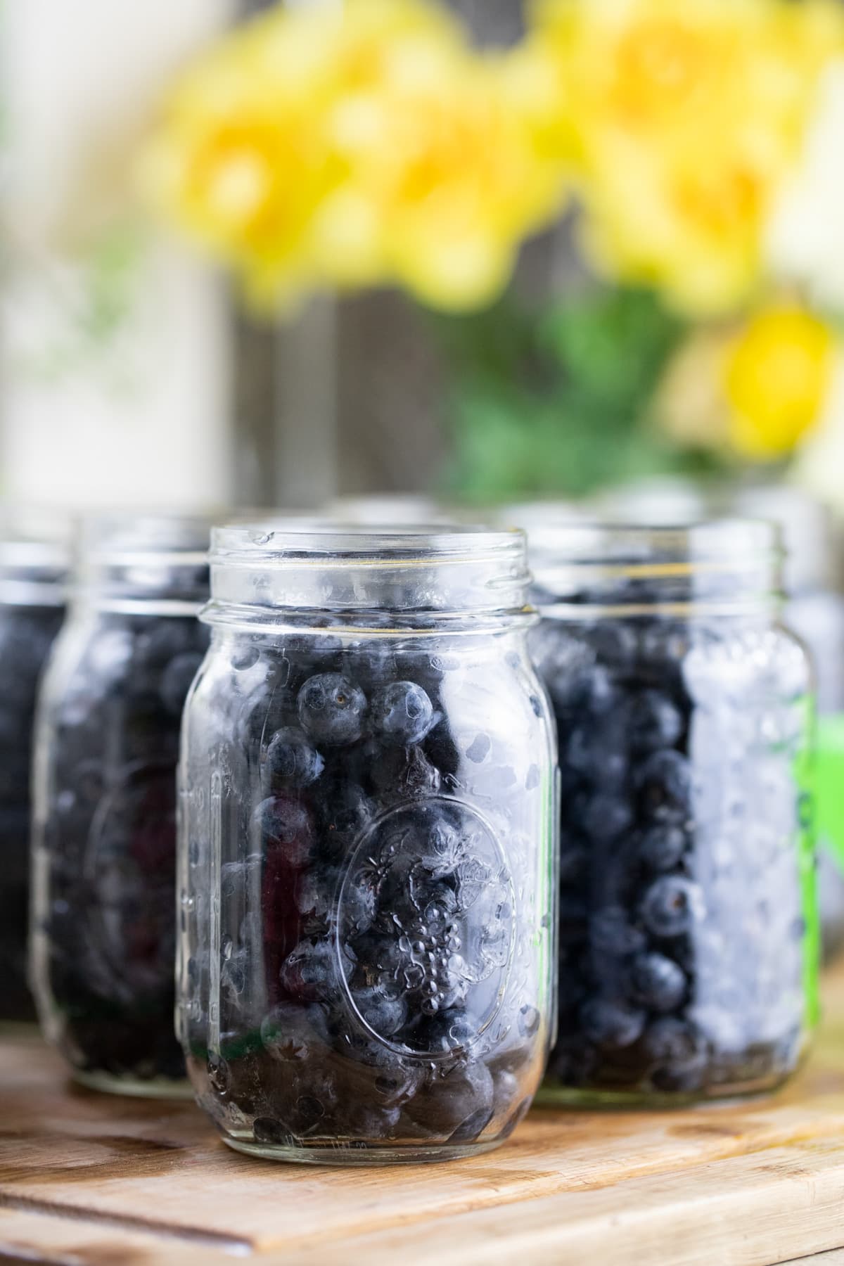 packing the jars with blueberries