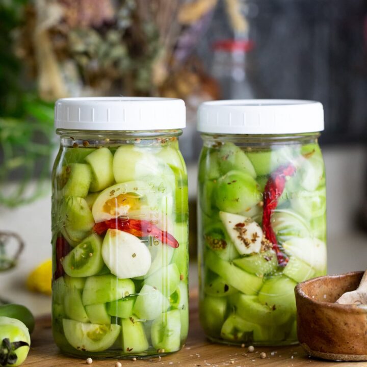 green tomatoes fermented in a jar