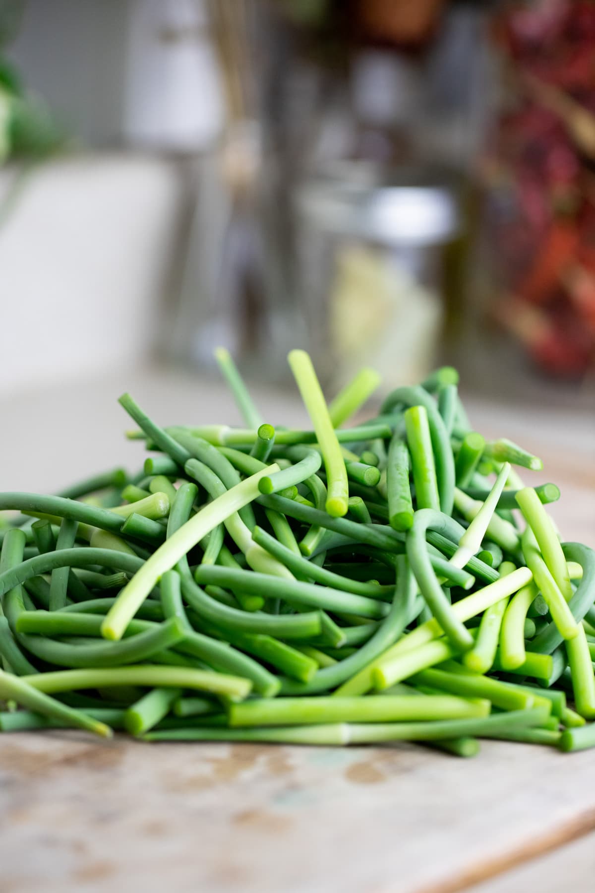 cutting the garlic scapes into smaller pieces