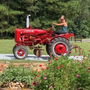 Lee Traister on a red tractor