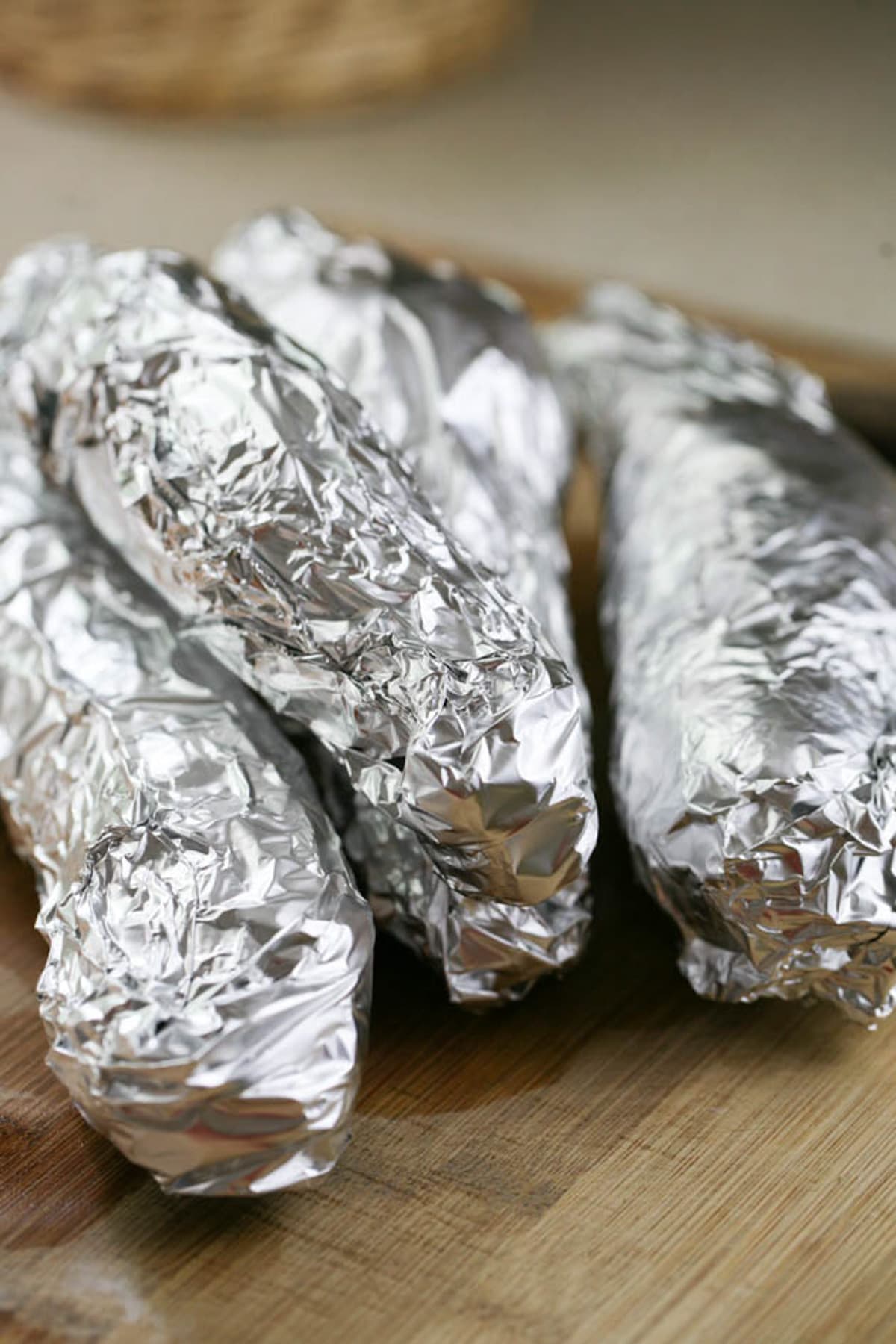 wrap the potatoes with tin foil