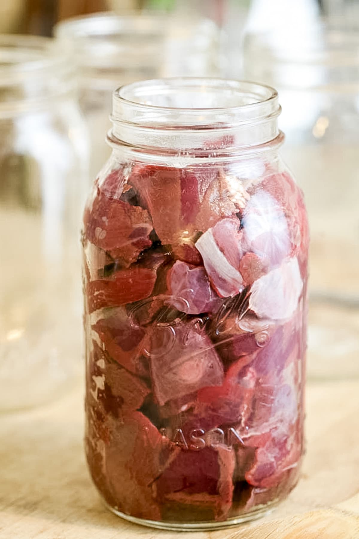 jar packed with cubbed meat