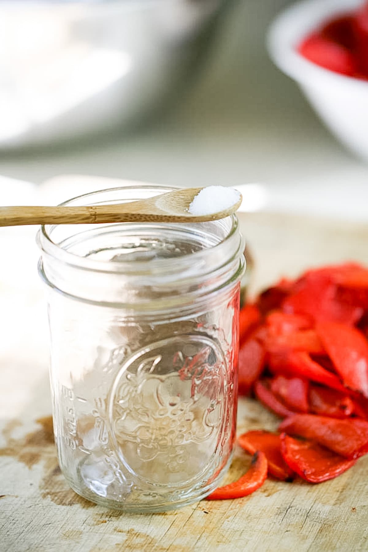 adding salt to each jar