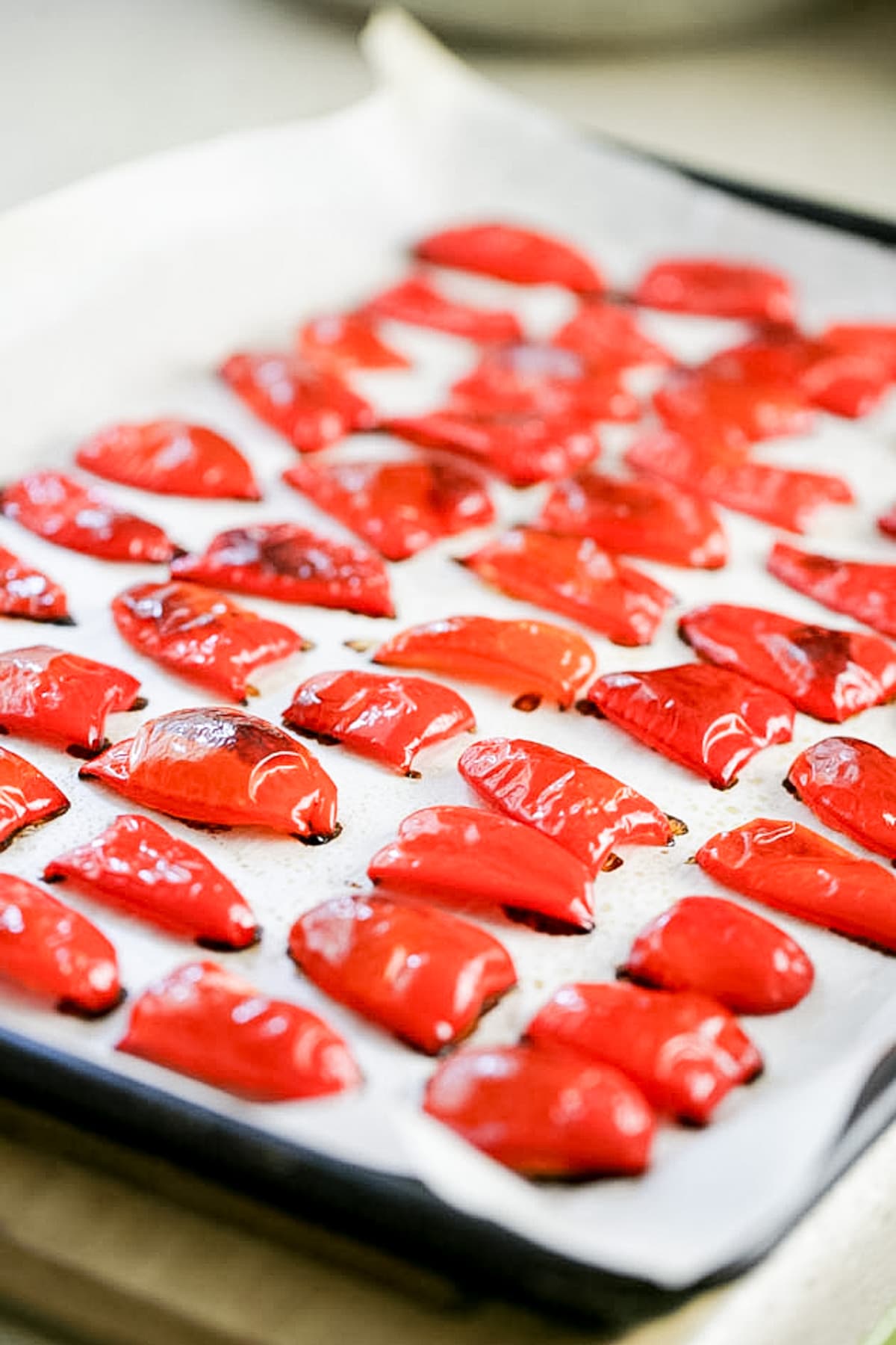 roasted red peppers on a baking sheet