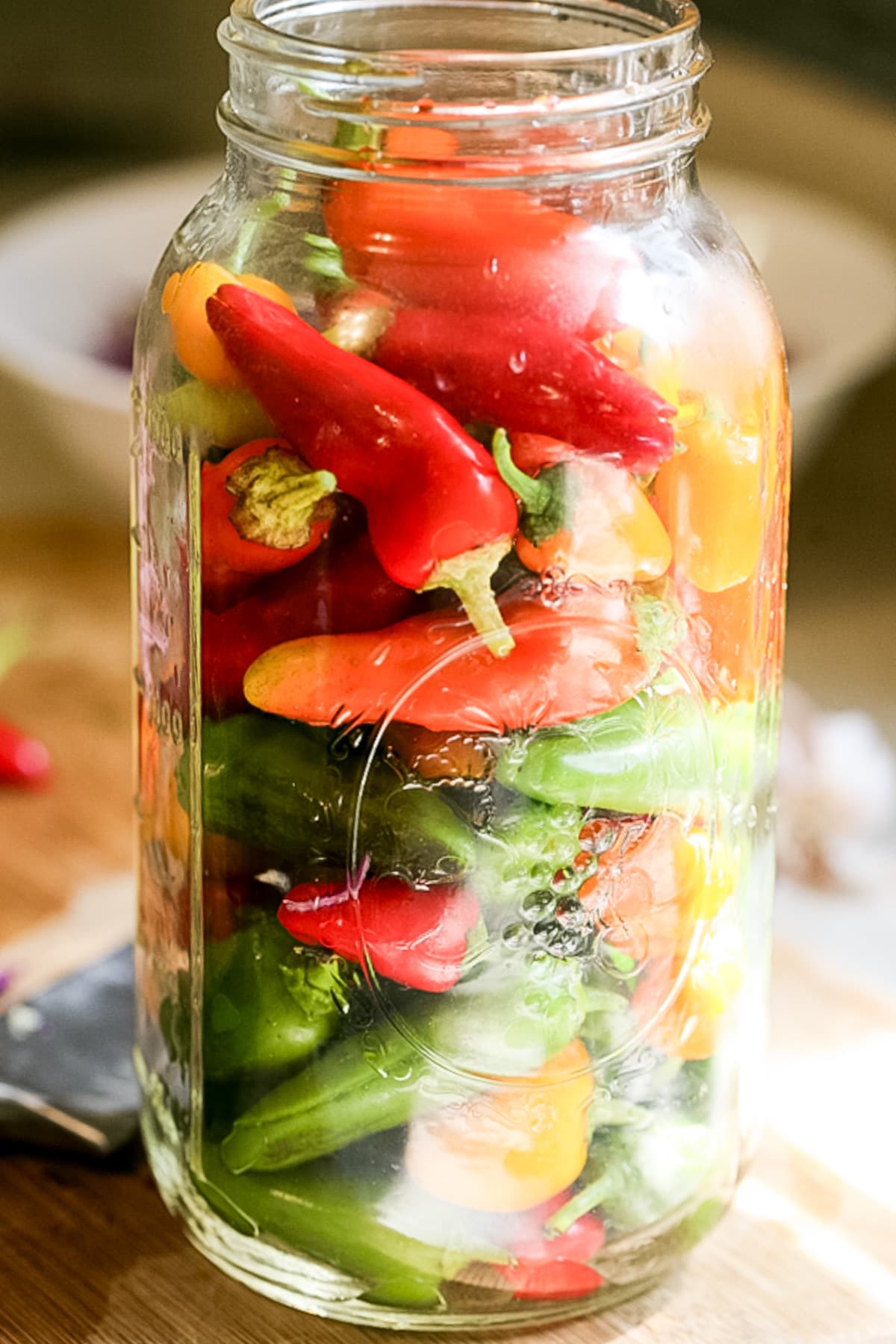 jar filled with peppers ready for brine