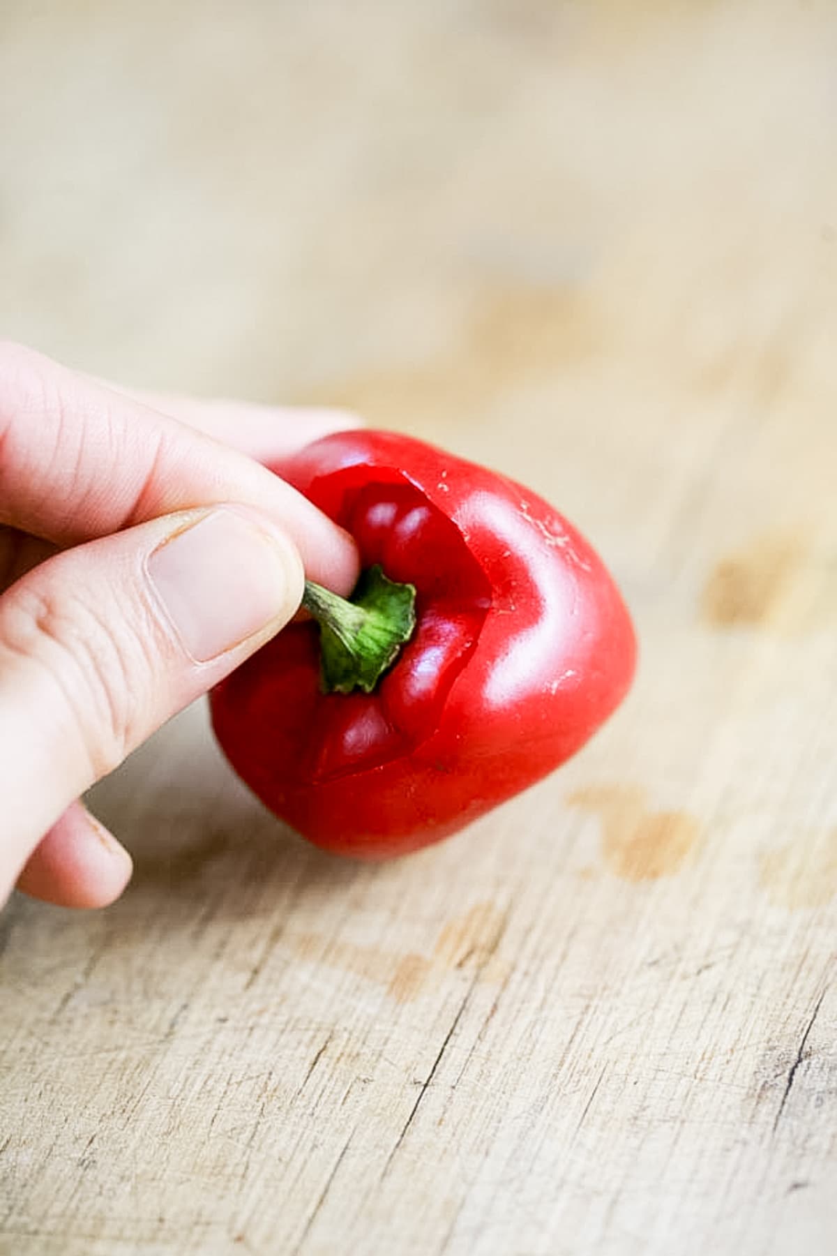 removing the stem from a bell pepper