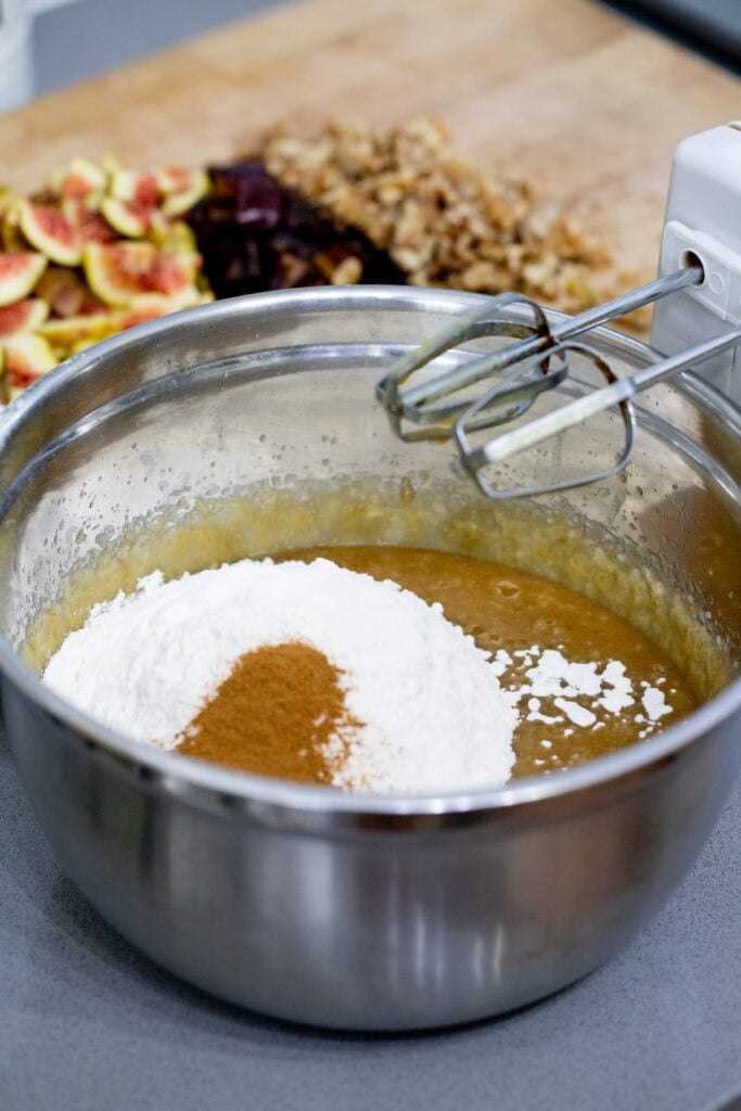 adding flour to the batter