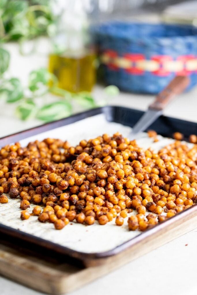 using a spatula to turn the chick peas