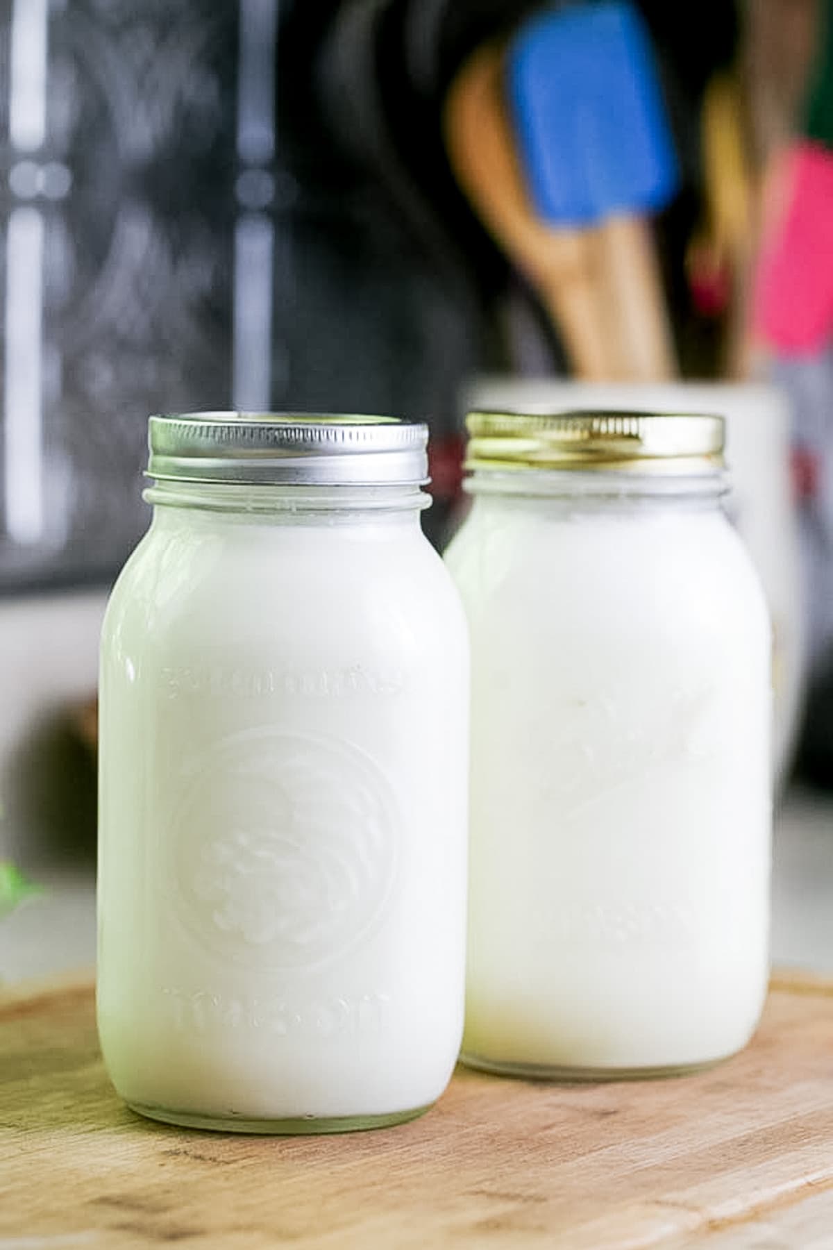 raw goat milk in quart jars