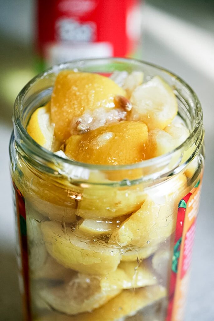 a jar of preserved lemon rinds ready for storage