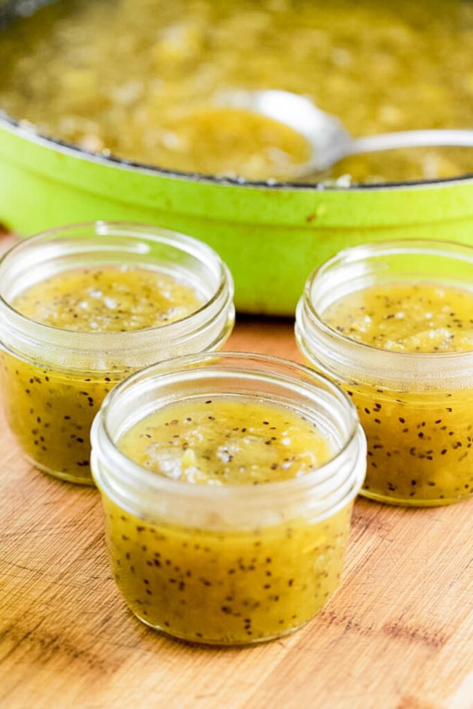 packing the jars with kiwi jam