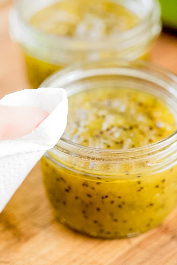 cleaning the rim of kiwi jam jars