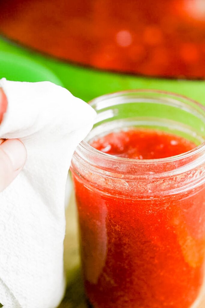 cleaning the rim of the jars