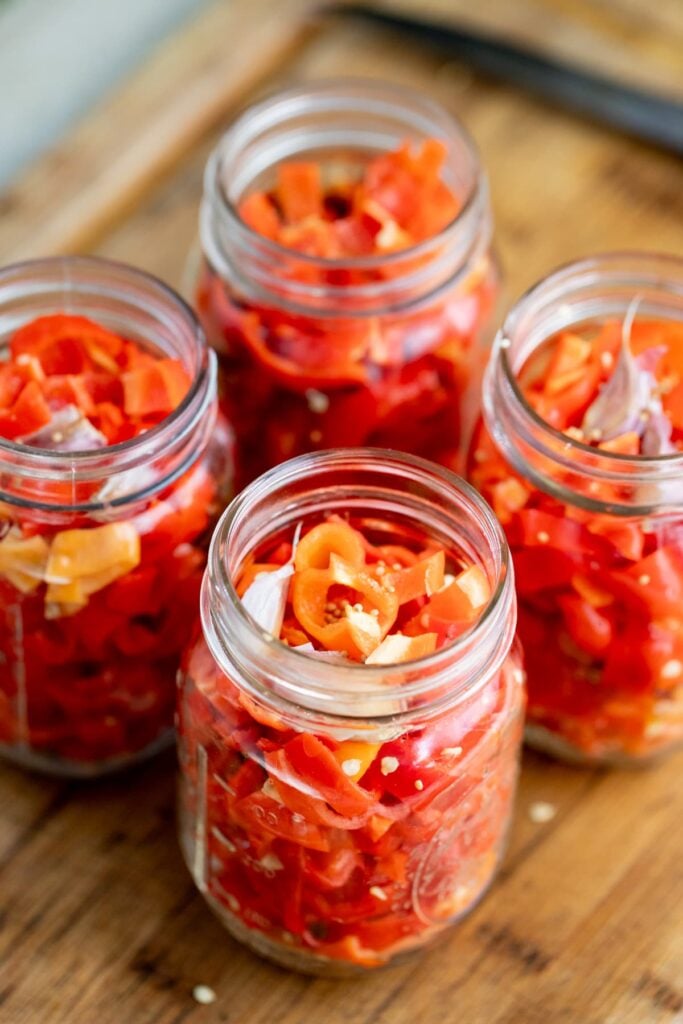 packing the jars with habanero peppers