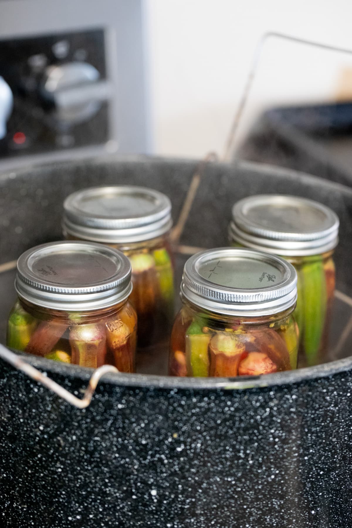 pickled okra in the water bath canner